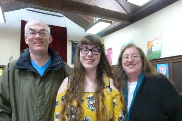 Caroline Bassett, with Mum Catherine and Dad Adrian, was happy and relieved when she gained 3A* and 2As. She will be studying French and Beginners Russian at Trinity College, Cambridge. (Lin) EMN-170817-200234001