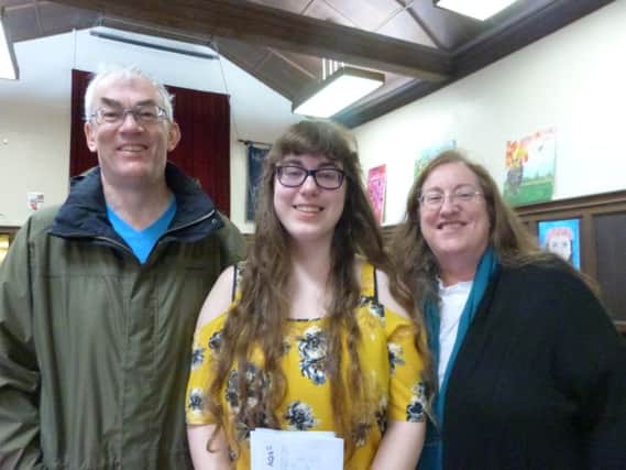 Caroline Bassett, with Mum Catherine and Dad Adrian, was happy and relieved when she gained 3A* and 2As. She will be studying French and Beginners Russian at Trinity College, Cambridge.  (Lin) EMN-170817-200234001