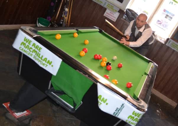 World snooker player Jamie Curtis-Barrett kicks off the speed pool challenge at the Bull and Dog charity fun day. EMN-170709-170142001
