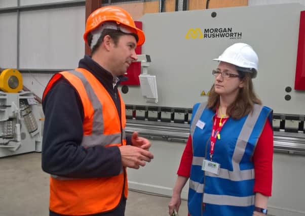 Mid UK managing director Chris Mountain shows MP Caroline Johnson around the newly kitted out engineering workshops. EMN-171109-182113001