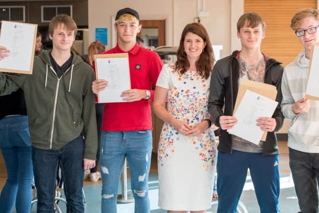 All smiles: Interim Principle Emma Day with students at the recent GSCE results day which highlighted the improvement across the board at Barnes Wallis