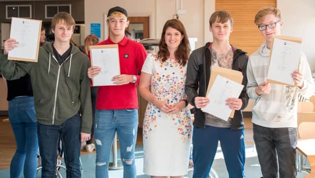 All smiles:  Interim Principle Emma Day  with students at the recent GSCE results day which highlighted the improvement across the board at Barnes Wallis