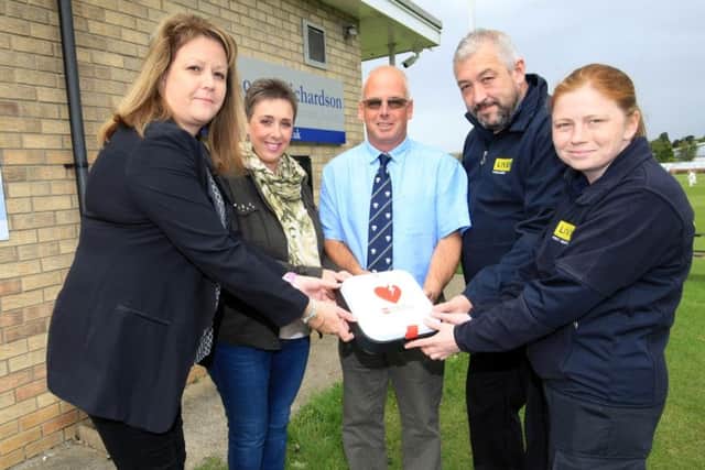 The presentation of a new defibrillator to Sleaford Cricket Club by NFH Consultancy Ltd and Lloyds Bank. Pictured are Nicola Humberstone from NFH Consultancy, Lisa Dawson, Gavin Hutson from the club, and from LIVES Marie Roffey and Andrew Robinson. EMN-170918-133148001