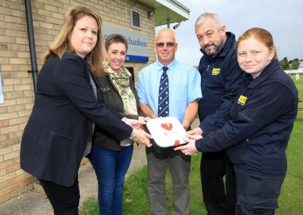 The presentation of a new defibrillator to Sleaford Cricket Club by NFH Consultancy Ltd and Lloyds Bank. Pictured are Nicola Humberstone from NFH Consultancy, Lisa Dawson, Gavin Hutson from the club, and from LIVES Marie Roffey and Andrew Robinson. EMN-170918-133148001