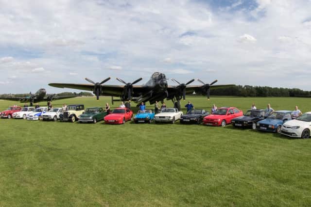 Just some of the motor club members who recently took part in a photoshoot at the Lincolnshire Aviation Hertiage Museum in East Kirkby.