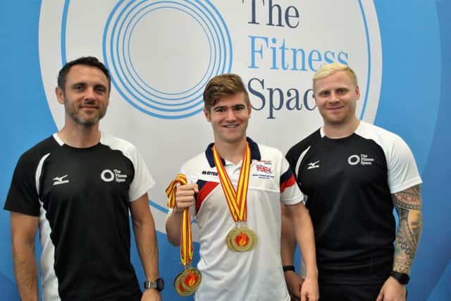 Golden guy: Declan Bennett (centre) with staff from The Fitness Space.