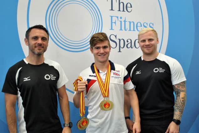 Golden guy:  Declan Bennett (centre) with staff from The Fitness Space.