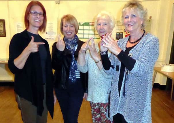 Members of Holton le Moor WI got some hands on help with British Sign Language EMN-170922-125503001