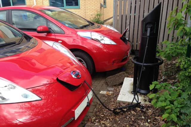 Gloucestershire Police unmarked Nissan Leaf cars being charged up. EMN-170918-114839001