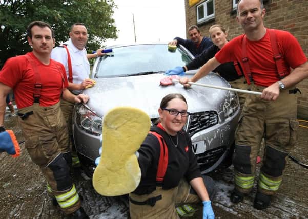 Charity car wash at Metheringham fire station on Saturday September 16th 2017. EMN-170919-122734001