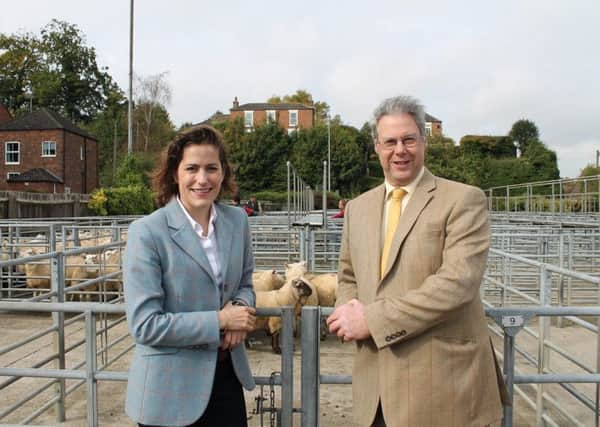 Victoria Atkins MP and Mark Leggott (county chairman of the NFU) at the Louth Cattle Market.