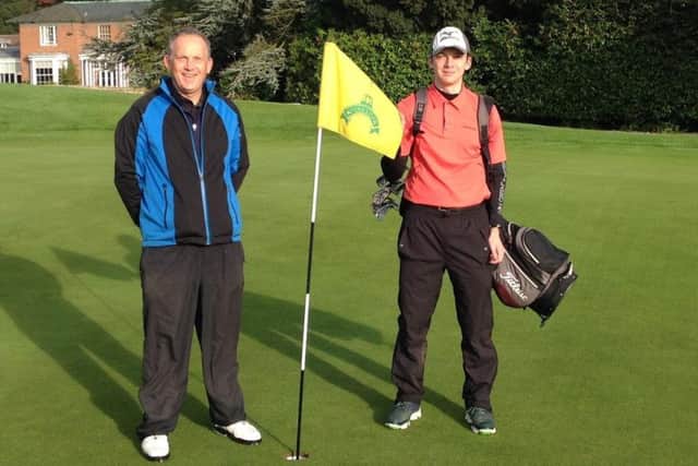 Kieran gets stuck into his marathon golf challenge, helped by dad and caddy Rick EMN-170921-145818002