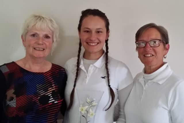 The Karen Smith Trophy was won by her niece Emily Templeton (centre), pictured with her mum Nicky (right) and Louth Golf Club's lady captain Fliss Smith EMN-170925-091653002