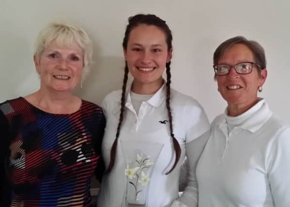 The Karen Smith Trophy was won by her niece Emily Templeton (centre), pictured with her mum Nicky (right) and Louth Golf Club's lady captain Fliss Smith EMN-170925-091653002