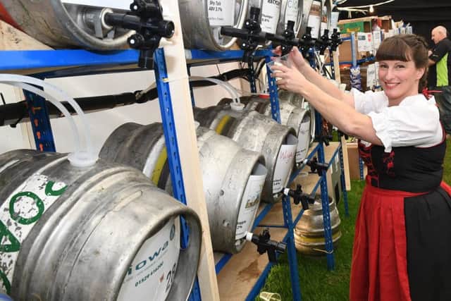 Oktoberfest organised by Sleaford Round Table. Sarah Freeman working behind the bar. EMN-170925-102359001