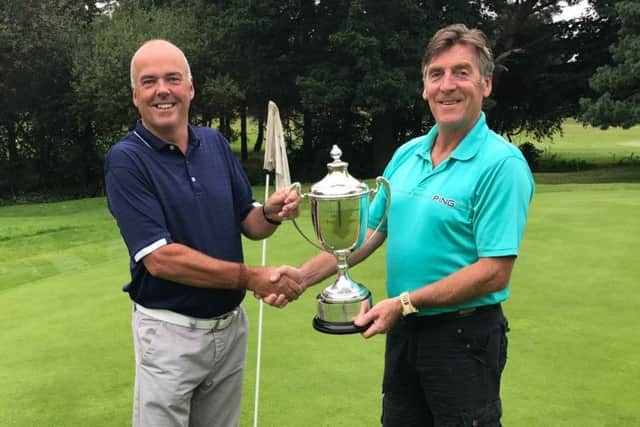 Mens captain Gaff Elliott (right) presents the Bass Charrington Trophy to mens open winner Tim Brumpton EMN-170925-120818002