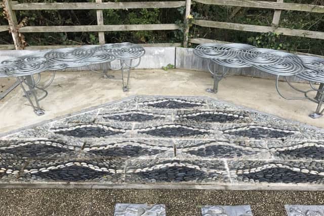 The completed riverside mosaic and bench on Rauceby Banks. EMN-170210-171319001