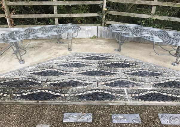 The completed riverside mosaic and bench on Rauceby Banks. EMN-170210-171319001