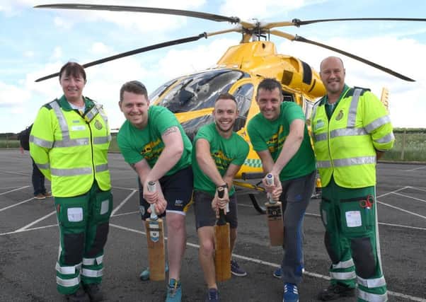 Shaun Brown, Richard Wells and Dave Newman who are going to attempt to break the record for longest indoor cricket net, raising money for Air Ambulance. L-R Jane Pattison - paramedic, Shaun, Richard, Dave, Neil Clarke - paramedic and ops manager. EMN-170210-171040001