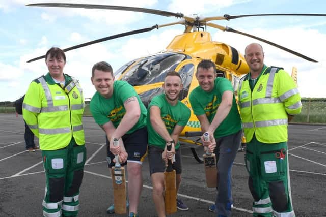 Shaun Brown, Richard Wells and Dave Newman who are going to attempt to break the record for longest indoor cricket net, raising money for Air Ambulance. L-R Jane Pattison - paramedic, Shaun, Richard, Dave, Neil Clarke - paramedic and ops manager. EMN-170210-171040001