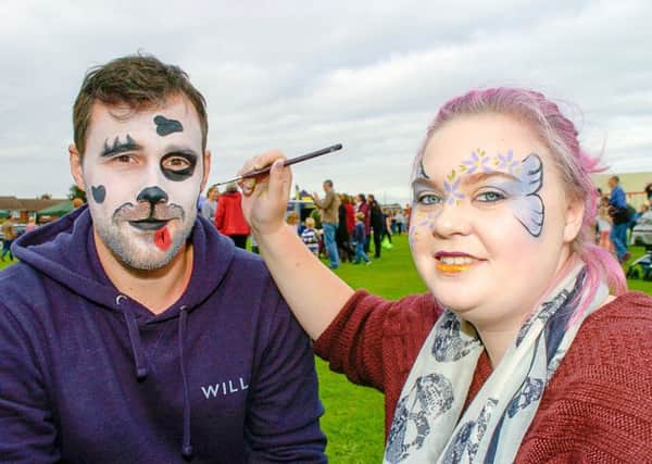 Leigh Taylor, of Lincoln, with Amy Scott-Nicholson, of Potterhanworth, trying out some facepainting