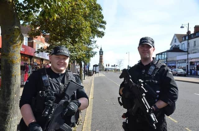 Armed officers in Skegness after the Parsons Green underground terror attack in London. Residents i can expect to see more armed officers on streets in the county at times when the terror risk is critical. Photo: Barry Robinson. ANL-170210-142646001