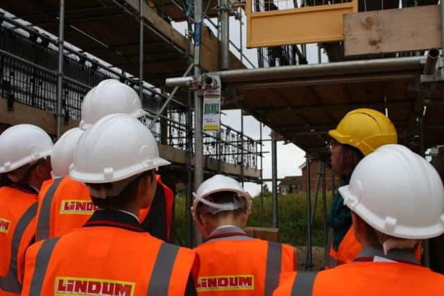 Pupils admiring the building site as part of their visit. EMN-170610-094737001