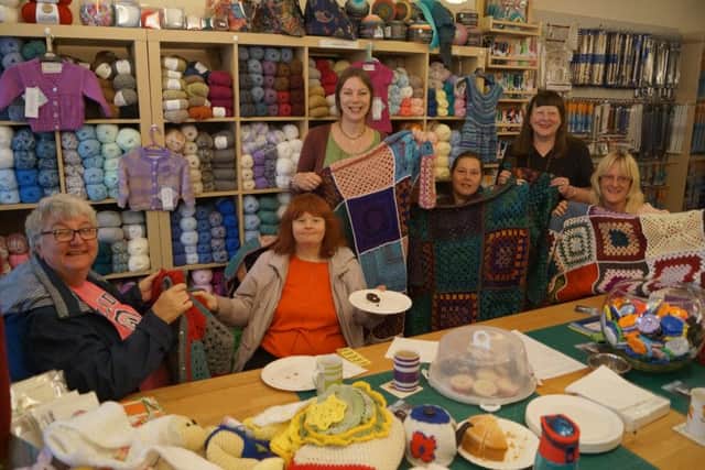 Gail Belinda Lee, standing centre, with some of the customers who supported her fundraising day and the blankets which will go to help those supported by the Lincoln-based Nomad Trust EMN-170510-235837001
