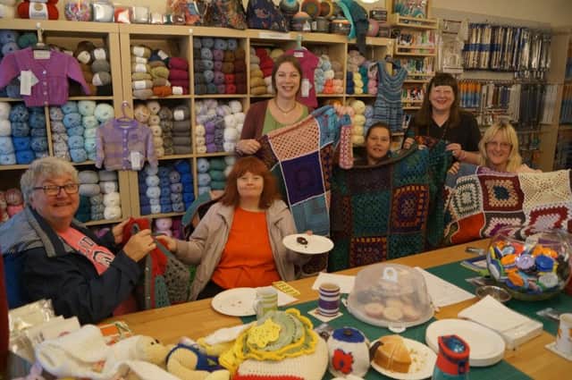 Gail Belinda Lee, standing centre, with some of the customers who supported her fundraising day and the blankets which will go to help those supported by the Lincoln-based Nomad Trust EMN-170510-235837001