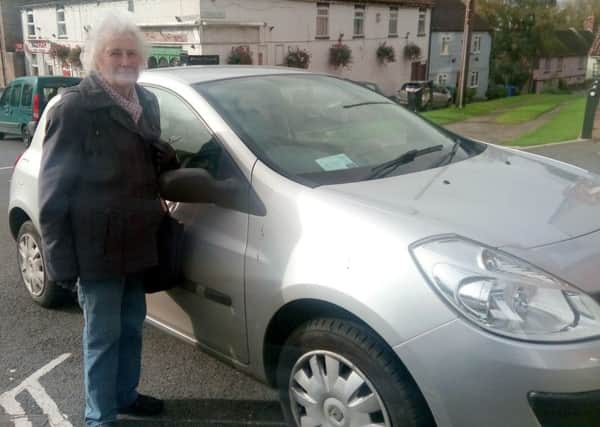 Muriel Niblock with her car displaying the disabled parking permit EMN-170610-075206001
