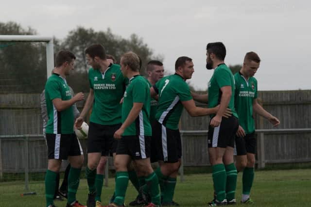 Town celebrate Hayden's first-half equaliser against Wellingborough PICTURE: Russell Dossett EMN-170910-172226002
