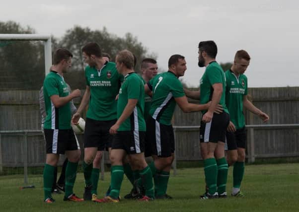 Town celebrate Hayden's first-half equaliser against Wellingborough PICTURE: Russell Dossett EMN-170910-172226002
