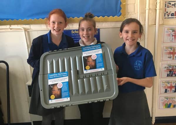 Caythorpe school children with the Lunettes Opticians and Vision Aid Overseas glasses collection box. EMN-170910-173028001