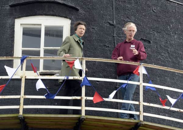 HRH The Princess Royal officially opens the Heckington WIndmill Regeneration Project, pictured on the viewing gallery of the mill with mill manager Jim Bailey. Picture: Sarah Washbourn - www.yellowbellyphotos.com EMN-171013-163827001