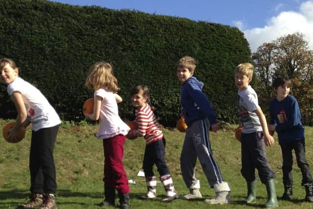 Youngsters getting involved in pumpkin events at Easton Walled Gardens. EMN-171016-151823001