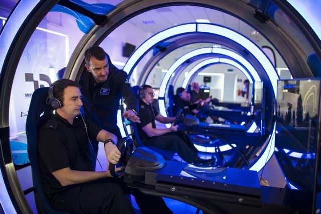 Lincolnshire Police officers hone their driving skills on the Playstation Gran Turismo game. Photo courtesy of Drew Gibson via Playstation. EMN-171017-171658001