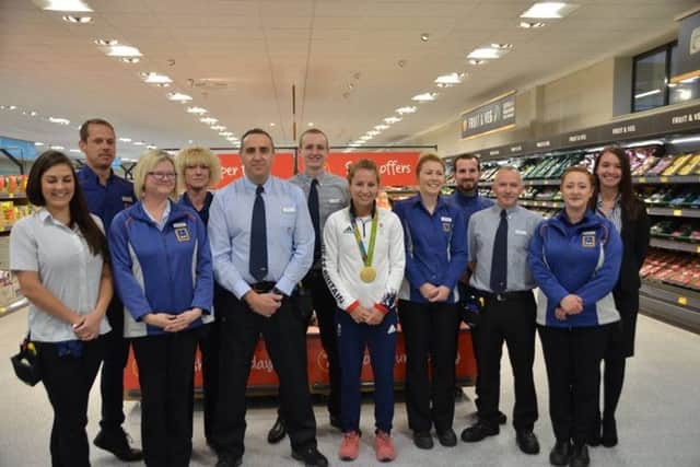 Olympic gold medallist and MBE Shona McCallin with staff at the new Aldi store in Skegness. Photo: Barry Robinson. ANL-171019-091905001