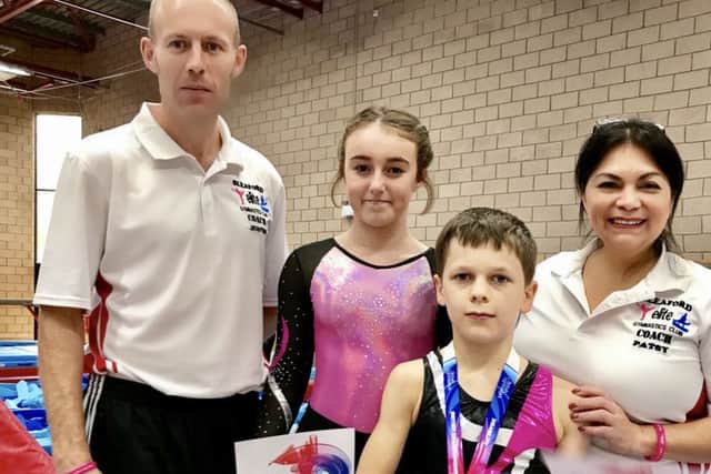Esmie and Logan with Sleaford Elite Gymastics Club coaches Justin Brown and Patsy Shields EMN-171019-111502002