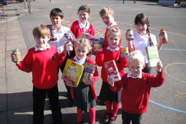 Pupils from Leasingham St Andrew's CofE Primary School with items for the food bank.