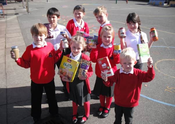 Pupils from Leasingham St Andrew's CofE Primary School with items for the food bank.