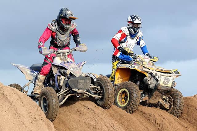 Previous quads winner Oliver Sansom passes a rival. Photo: Mike Wood.