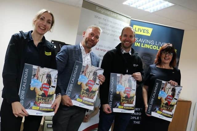 Pictured at the calendar launch are representatives from LIVES with calendar judges Chris Strawson from DPS and Rob Hammond from Lincs FM. EMN-171026-153921001
