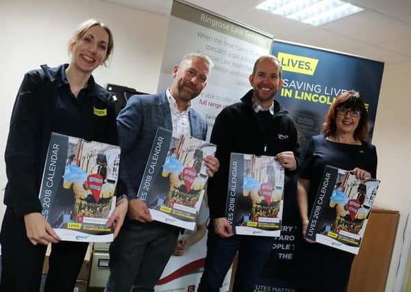 Pictured at the calendar launch are representatives from LIVES with calendar judges Chris Strawson from DPS and Rob Hammond from Lincs FM. EMN-171026-153921001