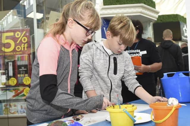 Children in Skegness take part in a Spooky Pebble Paint workshop at The Hildreds shopping centre. Luke Thompson, six and Sam Bettison, seven with The Jolly Fisherman
Picture: Sarah Washbourn - www.yellowbellyphotos.com