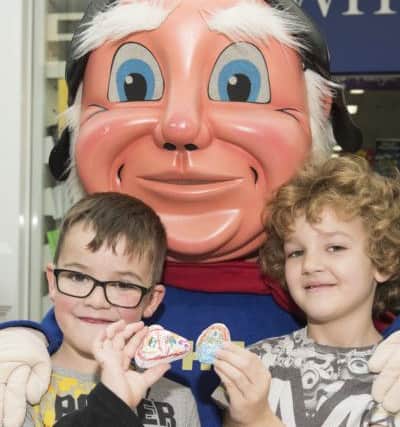 Luke Thompson, six and Sam Bettison, seven with The Jolly Fisherman.