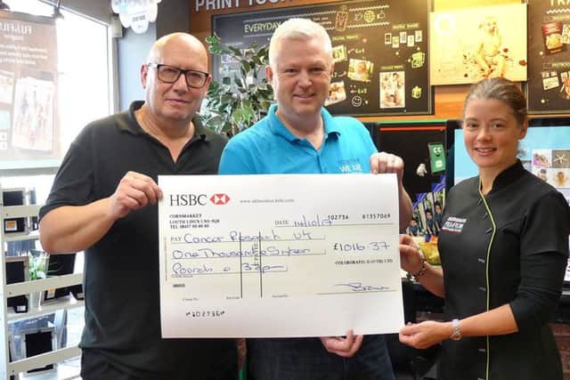 Colorgrafix directors, Trevor Brown and Samantha Brannick, with Simon West from Louth Run For Life.