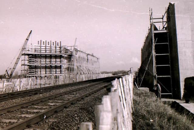 The A15 bypass bridge takes shape over the Sleaford to Grantham railway line in 1992, despite waterlogged conditions for the road constructors. EMN-170211-175724001