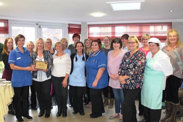 Wolds Care Centre staff members with the award.