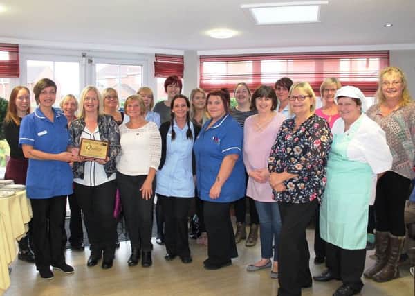Wolds Care Centre staff members with the award.