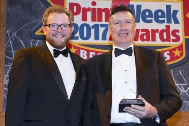 Ken Calderwood (right) receives the Newspaper Printer of the Year 2017 award from comedian Miles Jupp. EMN-170211-121954001